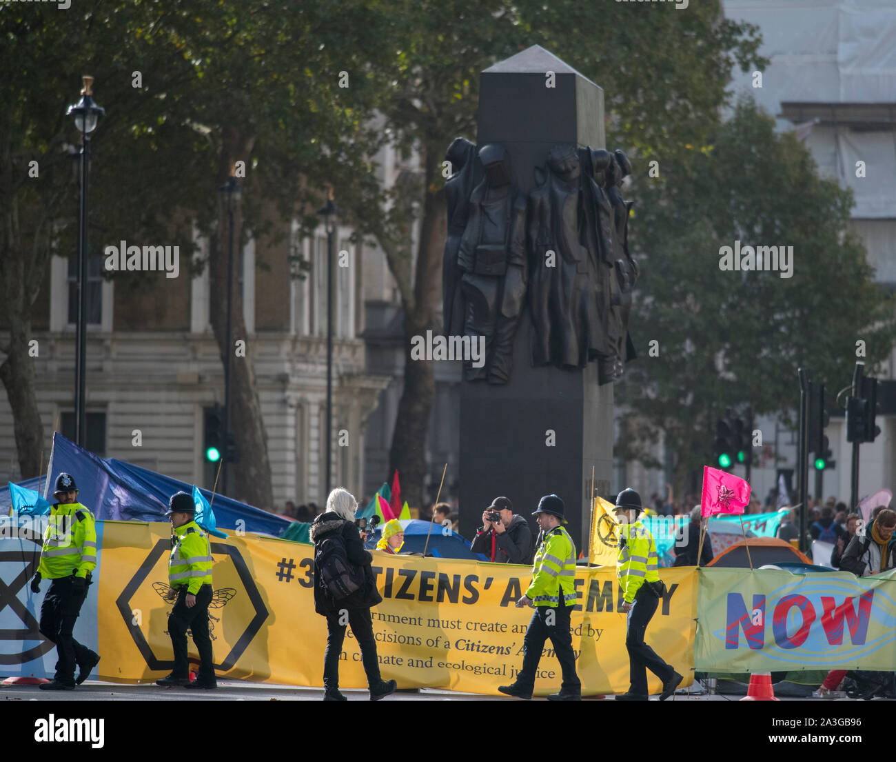 Westminster, London, UK. 8th October 2019. Extinction Rebellion activists block roads around Westminster in a second day of climate-change demonstrations. Whitehall is closed as demonstrators assemble close to the Downing Street entrance. Credit: Malcolm Park/Alamy Live News. Stock Photo