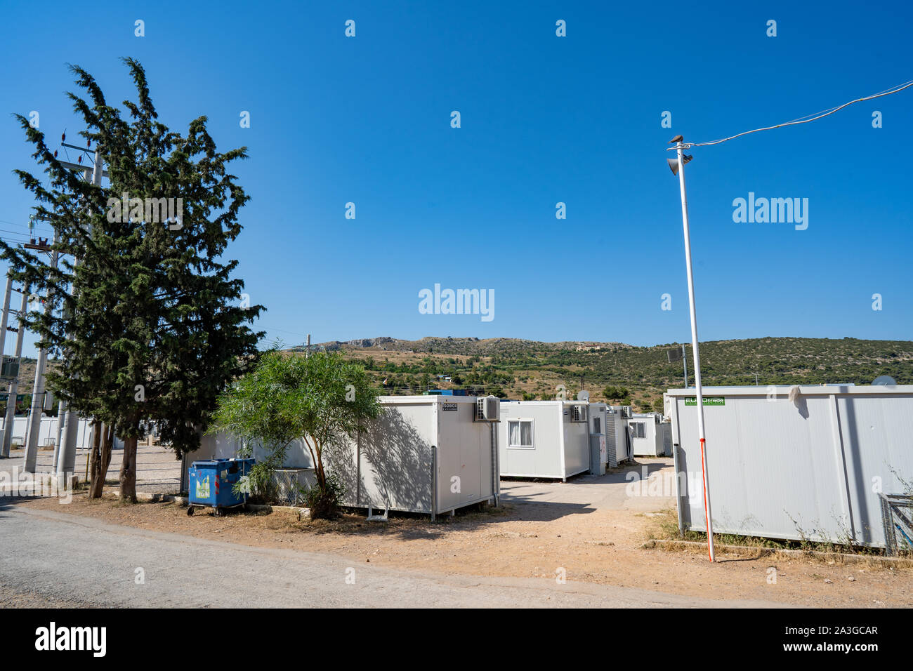 Typical isoboxes are seen in the residential area of Camp Sxistou.  Each isobox is currently home to around 4 people.    In 2018, there were almost 66,969 official applications for asylum according to the statistical data published by the Asylum service.  The UNHCR cites 15,670 as the number of refugees who have arrived in 2019. Stock Photo