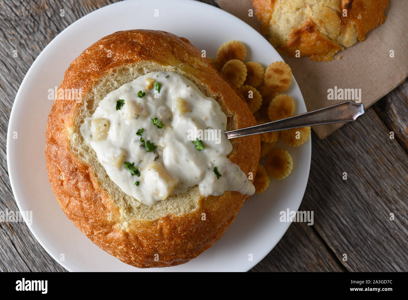 Overhead shot of a bread bowl of New England Style Clam Chowder with