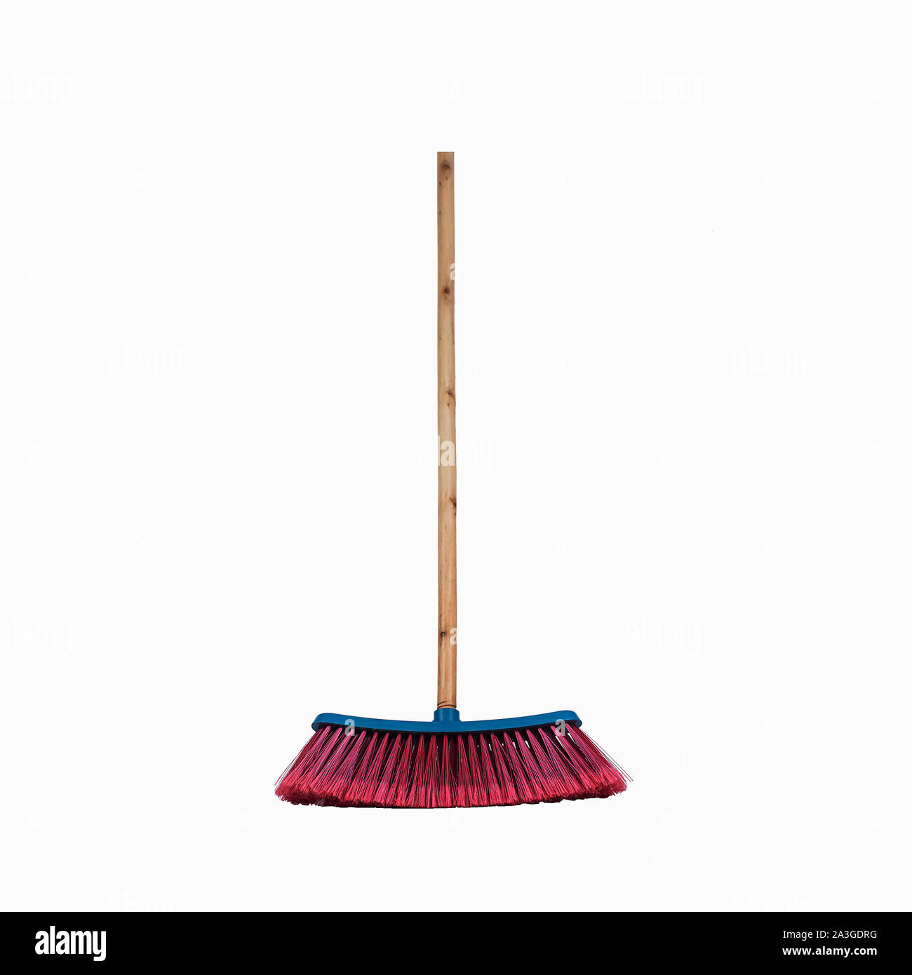 Red and Blue Broom with wooden handle standing cleaning hygiene