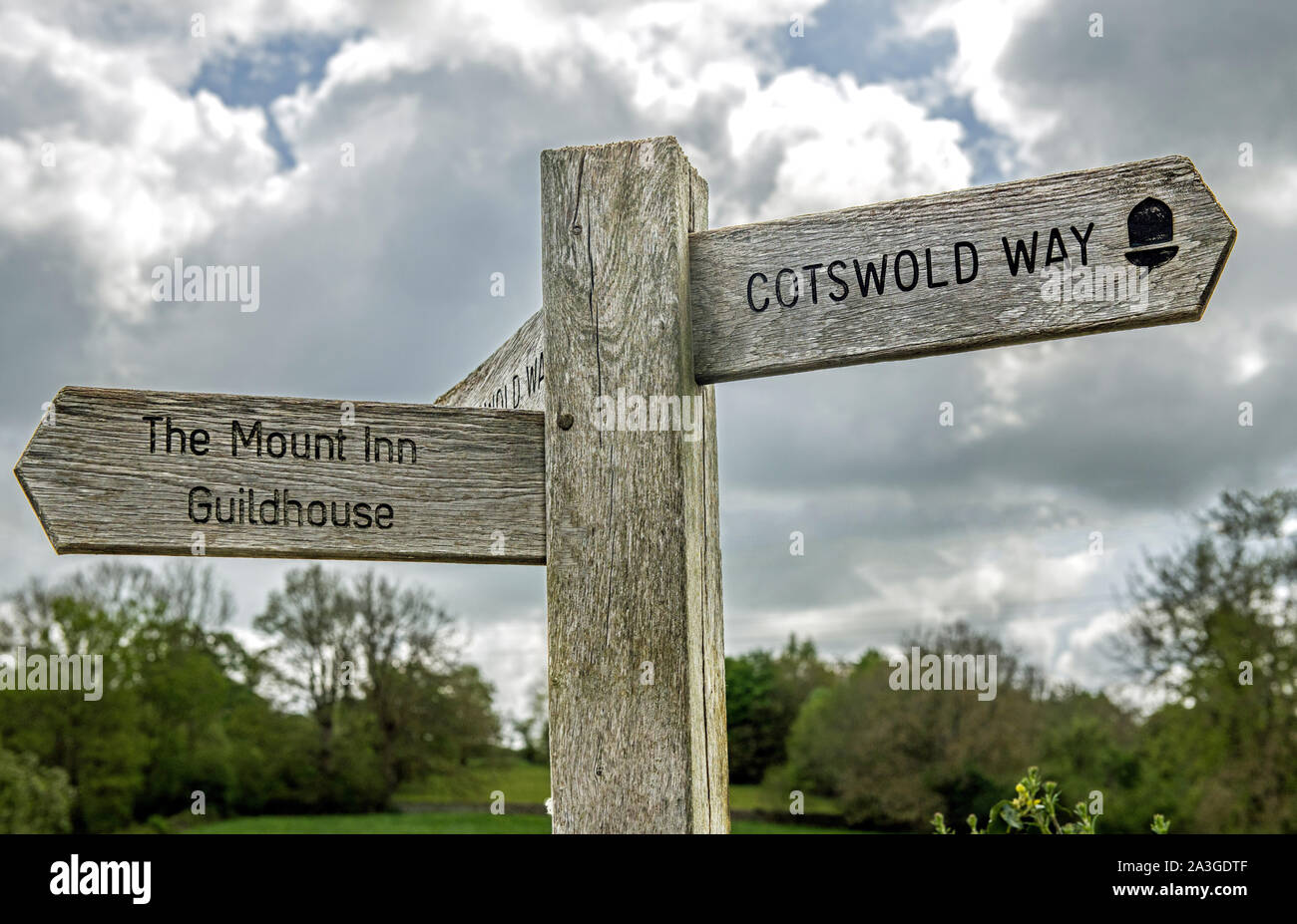 Wooden Fingerpost or waymarker giving directions in Stanton villages in the Gloucestershire Cotswolds Stock Photo
