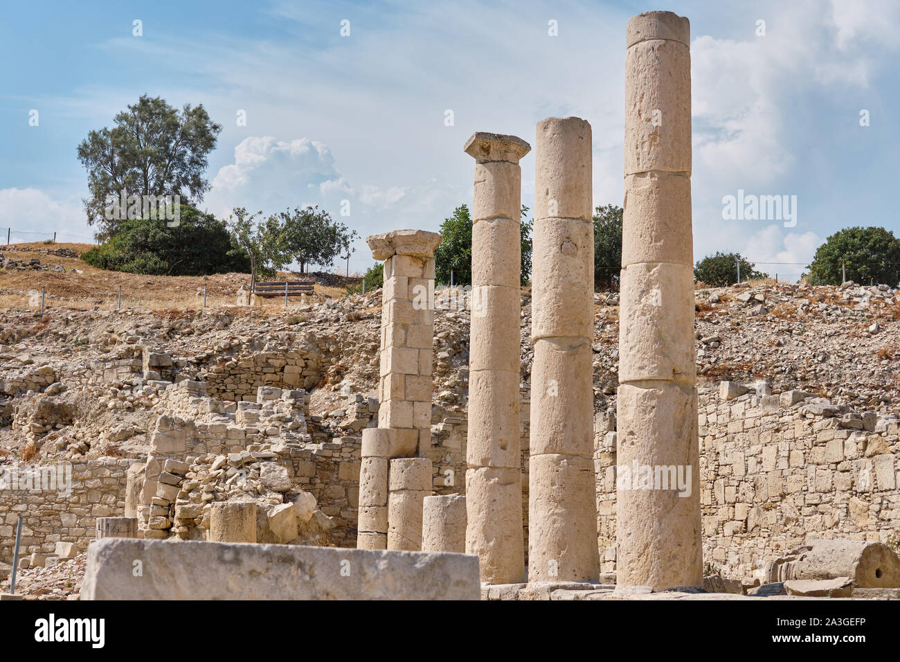 Ruins and columns of the Sanctuary of Apollo Hylates located at the beach of the azure mediterranean sea. Near 3 kilometers west of the Ancient Greek Stock Photo