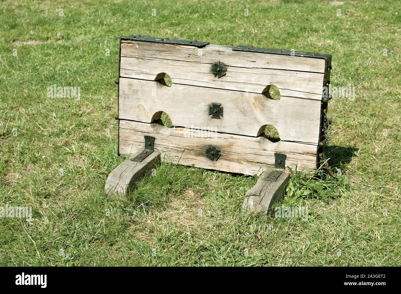 old wooden stocks  used for punishing offenders in the middle ages Stock Photo
