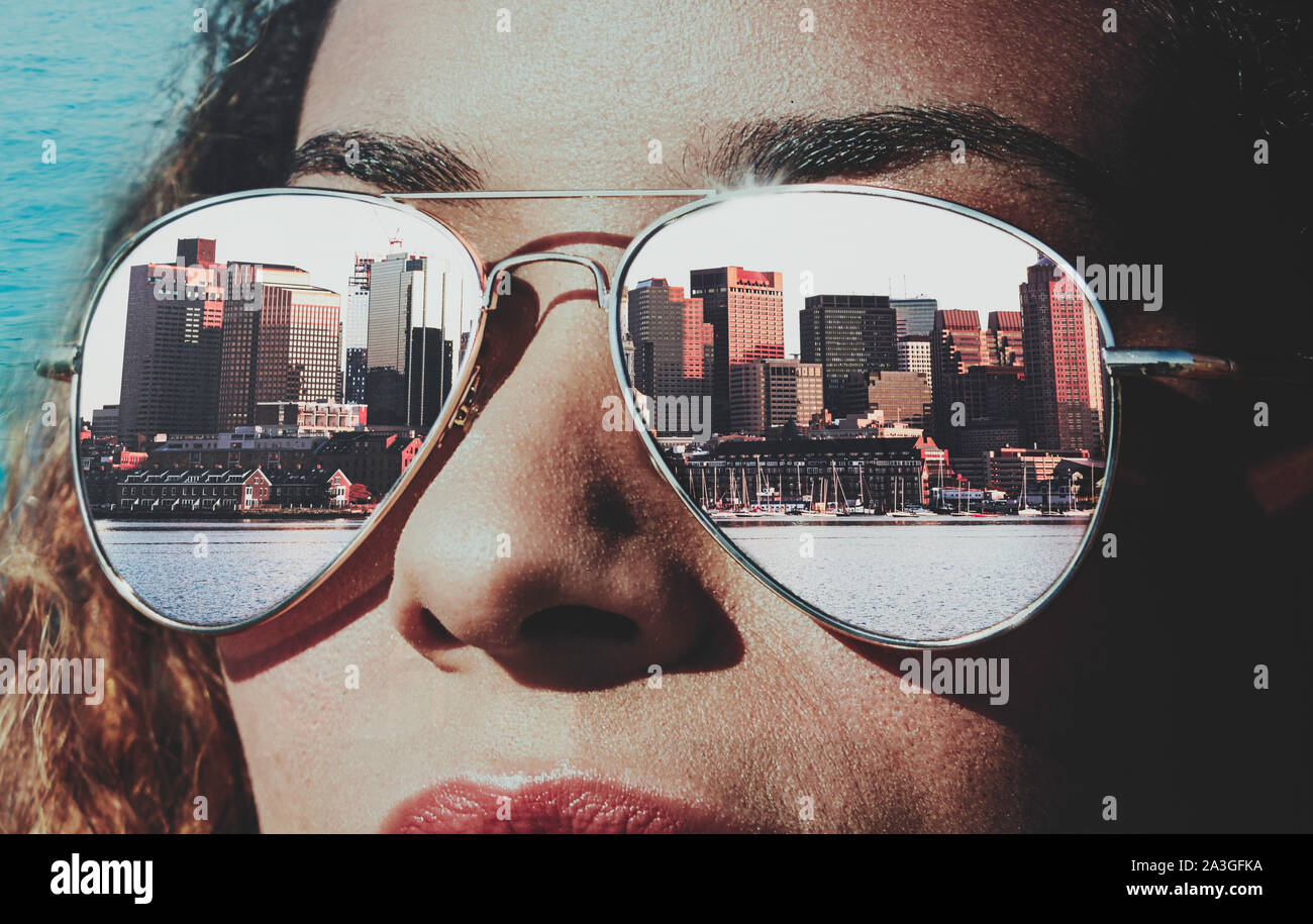 Woman with sunglasses and the reflection of the city of Boston Stock Photo