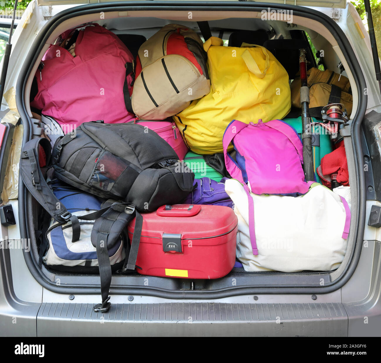 car trunk with lots of luggage and suitcase during the departure of family  holidays Stock Photo - Alamy