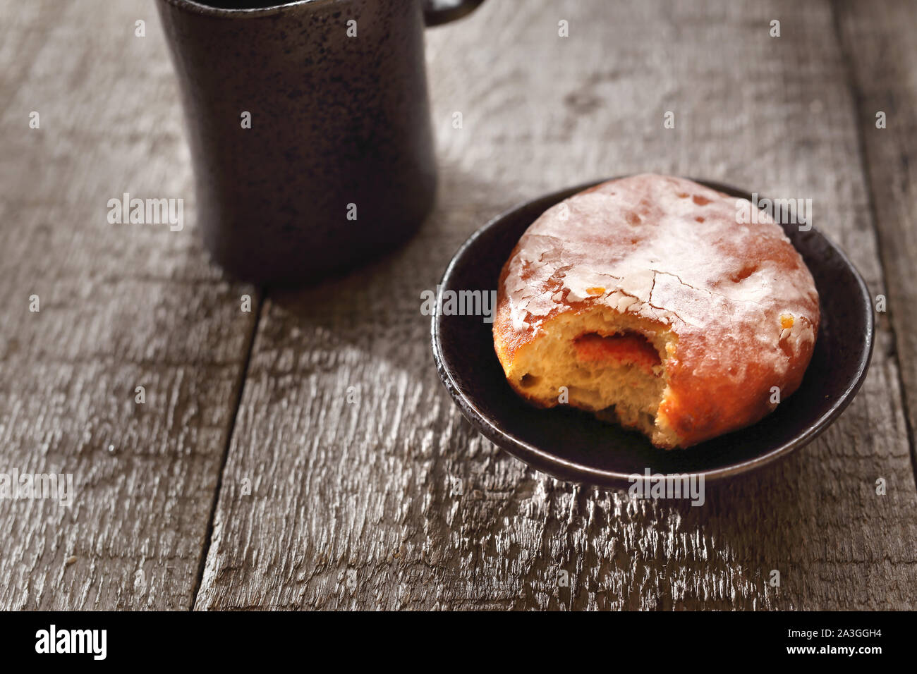 Traditional donuts with icing stuffed with marmalade. Stock Photo