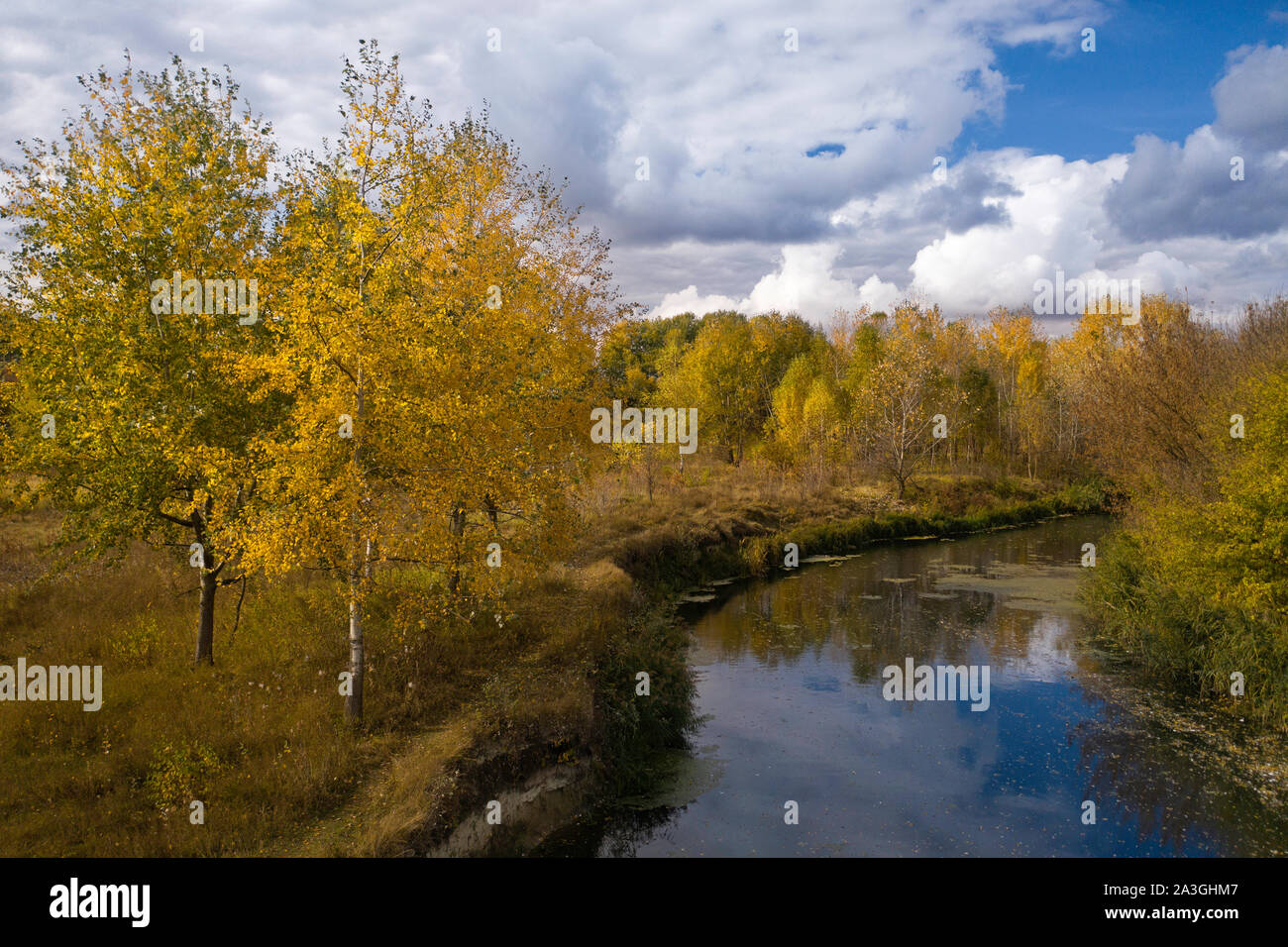 aerial view of autumn river with yellow trees Stock Photo