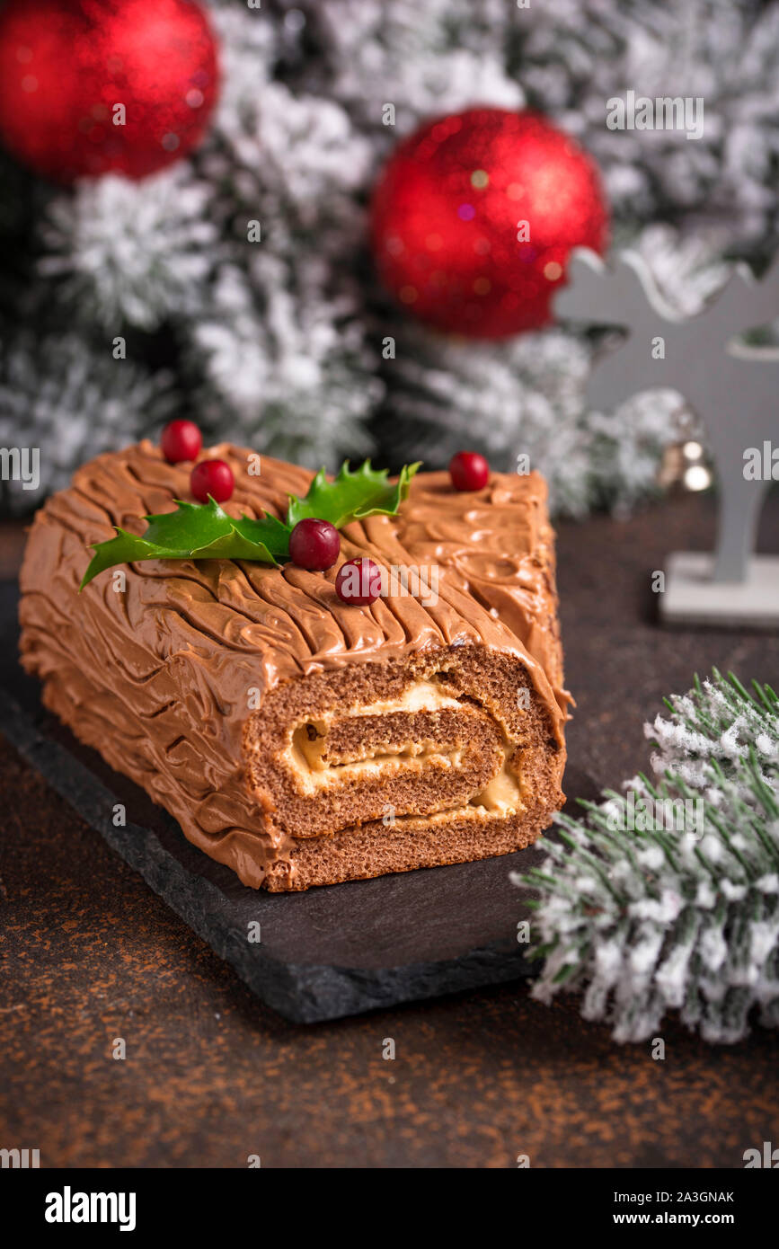 Christmas yule log cake. Traditional chocolate dessert Stock Photo