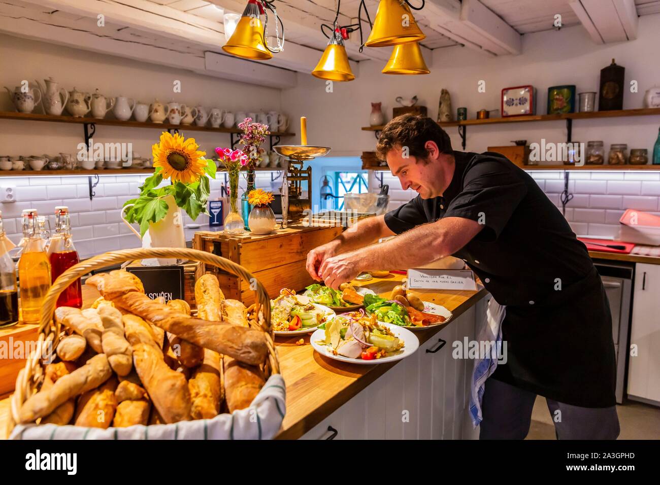 Sweden, County of Vastra Gotaland, Hokerum, Ulricehamn hamlet, Rochat family report, we find Vivien at Vilhelemsro restaurant preparing dishes with Knalten vegetables Stock Photo