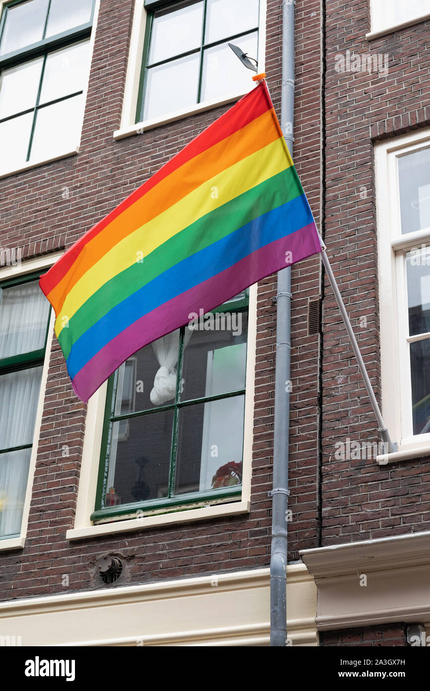 Rainbow Pride Flag at Building in Amsterdam Stock Photo