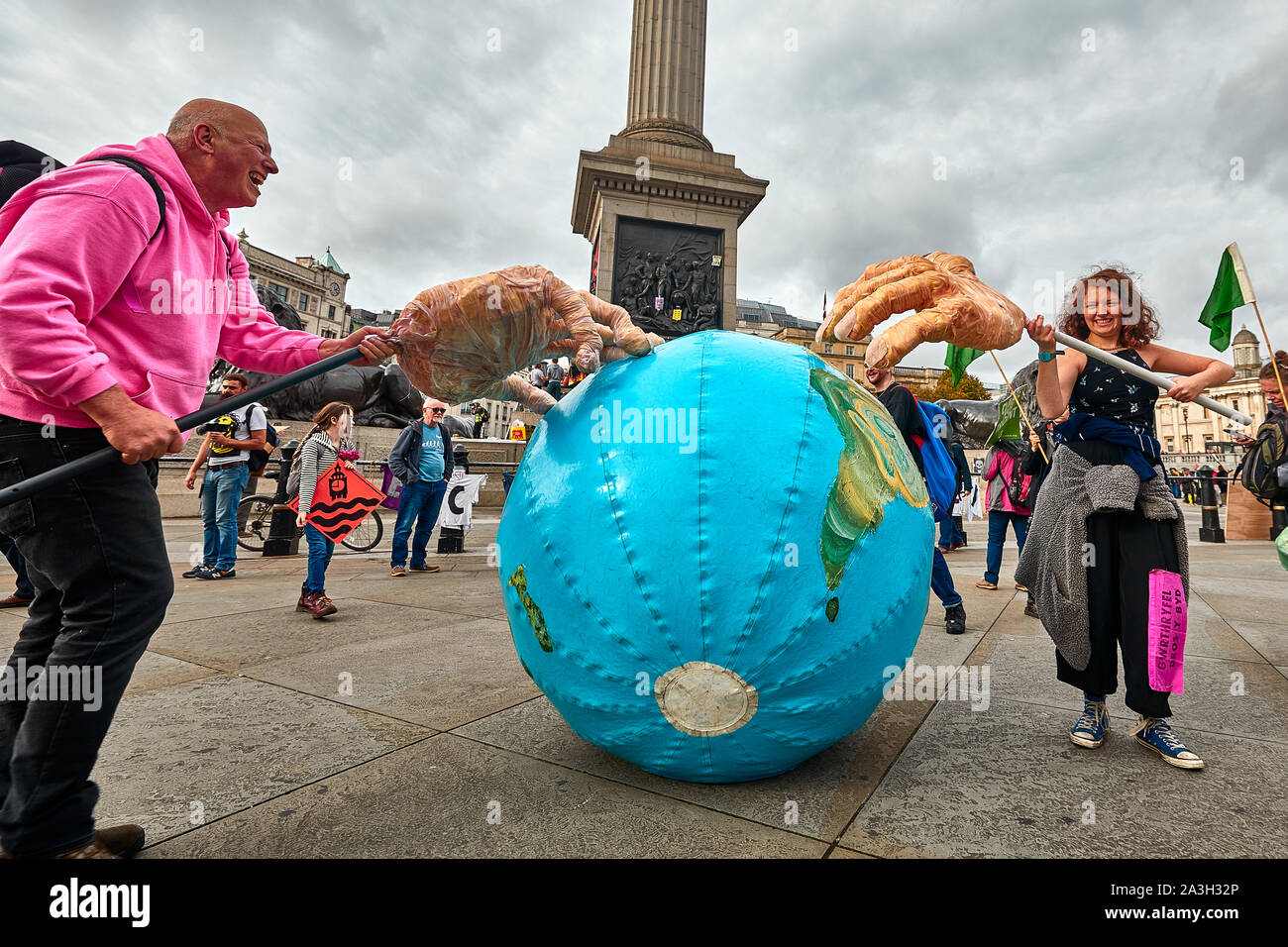 London, U.K. - Oct 8, 2019: Environmental campaigners with an inflatable globe in Trafalgar Square on the second day of a planned two weeks of protests by Extinction Rebellion. Stock Photo