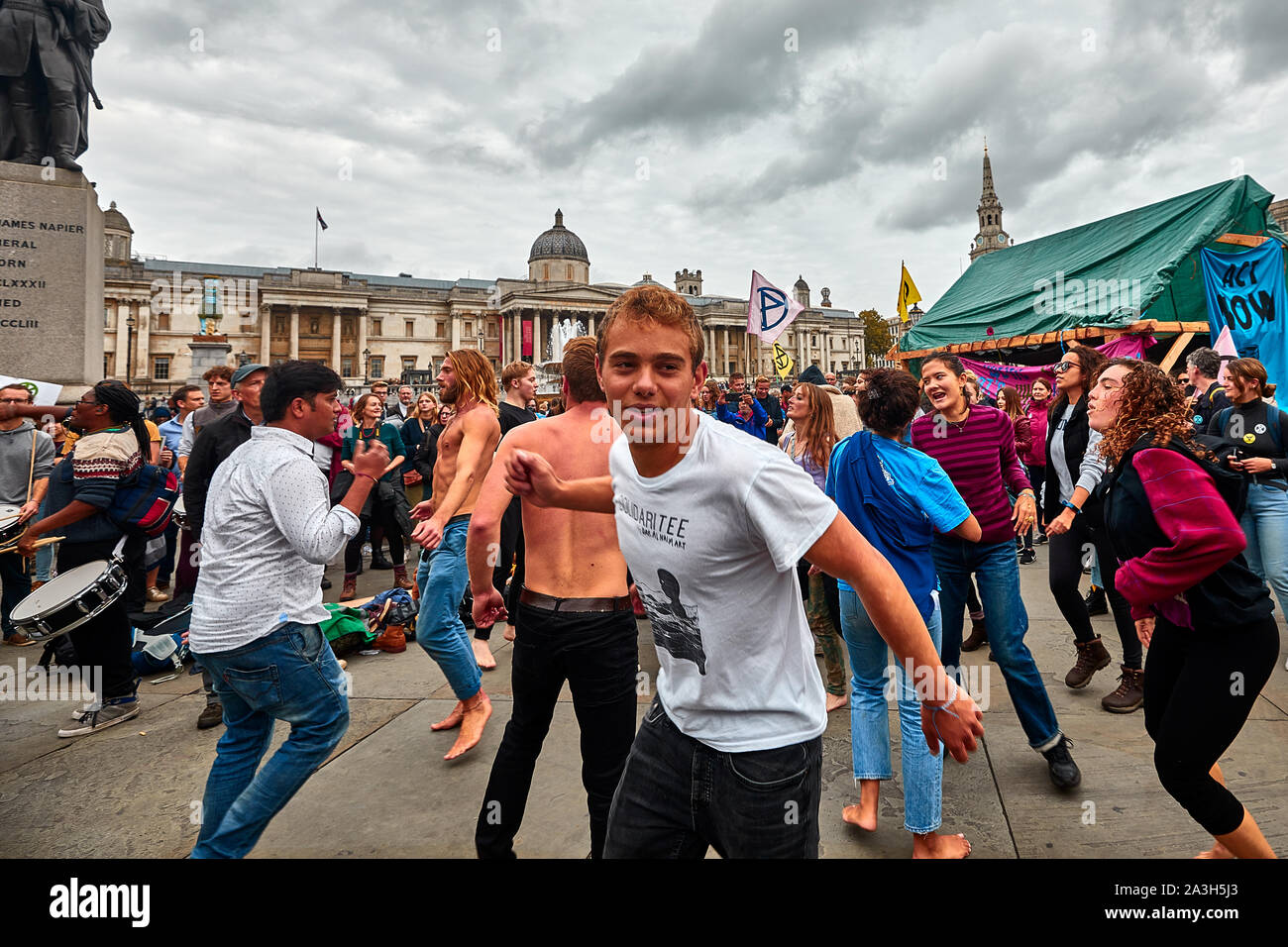 London, U.K. - Oct 8, 2019: Dancers in an impromptu display on the second day of an occupation of Trafalgar Square by campaigners from Extinction Rebellion. Stock Photo