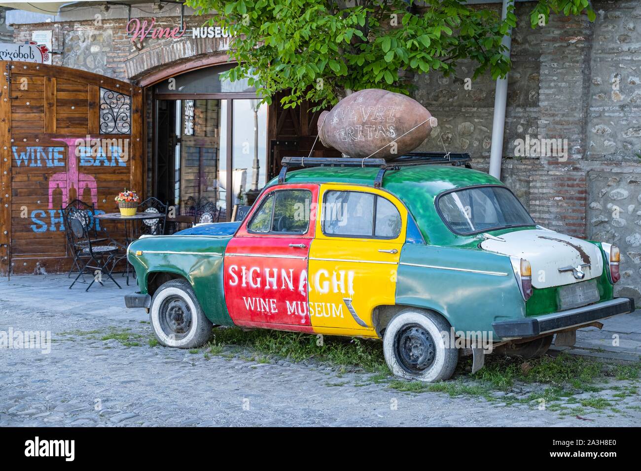 Georgia, Kakheti region, Sighnaghi fortified village, advertising for the Wine Museum on a vintage Soviet car Stock Photo