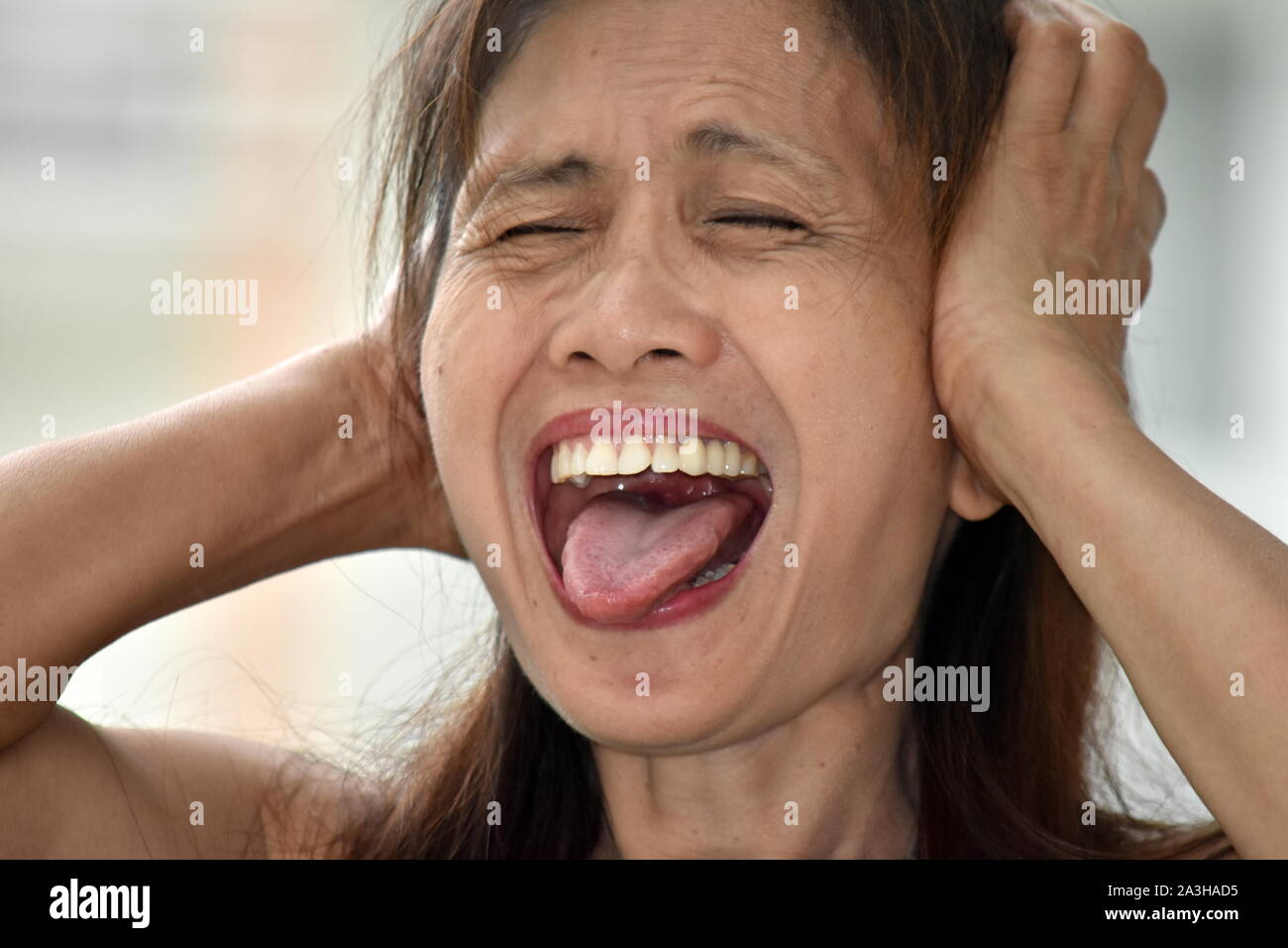 A Stressful Filipina Woman Stock Photo