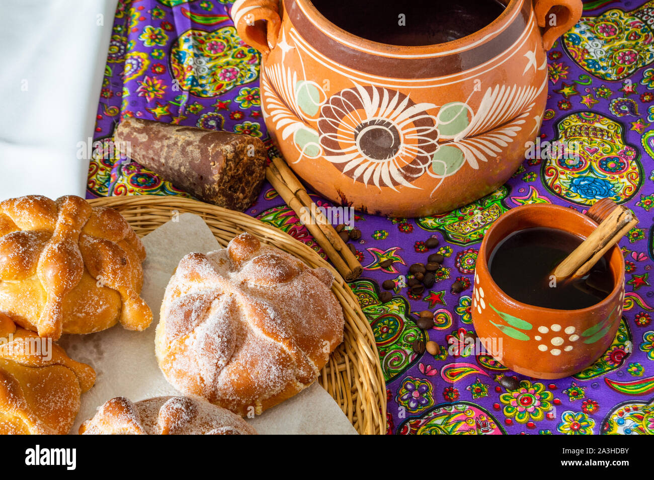 Traditional Mexican bread of the dead (pan de muerto) served with coffee  from the pot (cafe de olla), this bread is made around the day of the dead  ce Stock Photo -