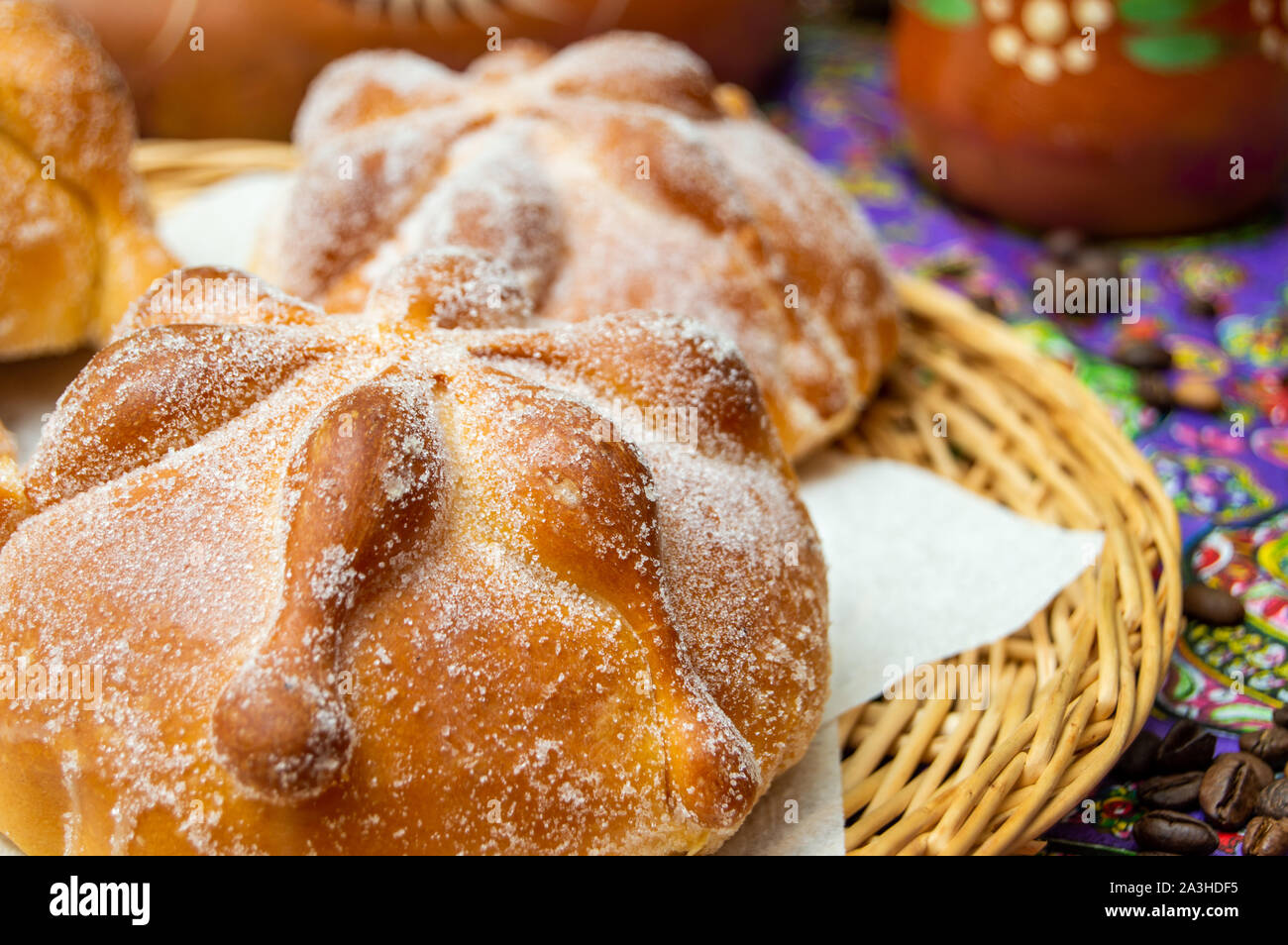 Traditional Mexican bread of the dead (pan de muerto) served with coffee from the pot (cafe de olla), this bread is made around the day of the dead ce Stock Photo