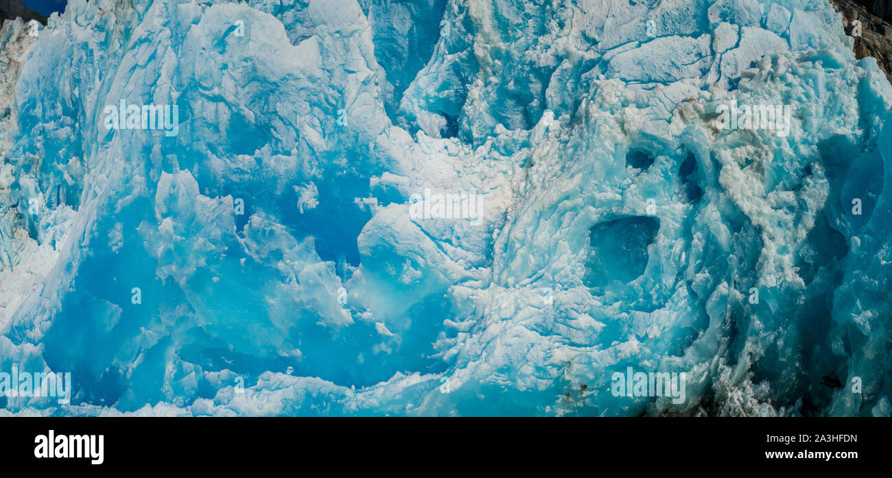 USA, Alaska, Tracy Arm - Fords Terror Wilderness, Aerial panoramic view of shattered blue face of Dawes Glacier on summer afternoon Stock Photo