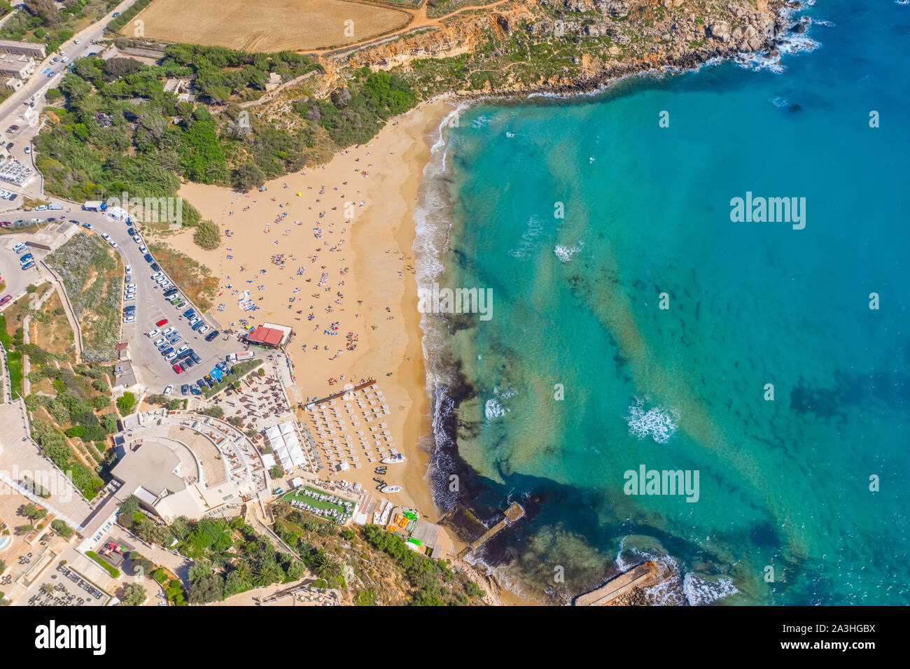 Aerial vew from fying drone view of the wild beach with sunbathers resting people Stock Photo