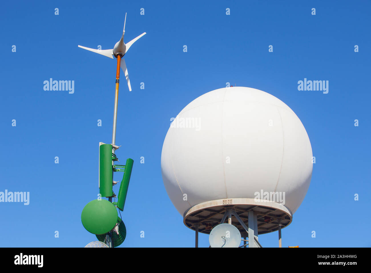 Meteorological radar station on the top of Sierra de Fuentes, Spain. Antennas, wind turbine and dome Stock Photo