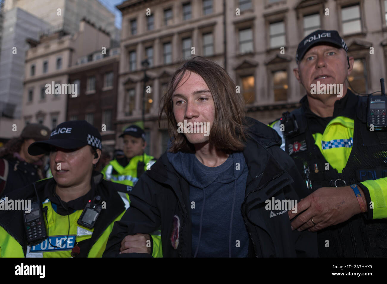 Westminster, London, UK. 8th Oct, 2019. Extinction rebellion protesters locked together on Whitehall, Westminster. Police use cutting gear to set them free. Penelope Barritt/Alamy Live News Stock Photo