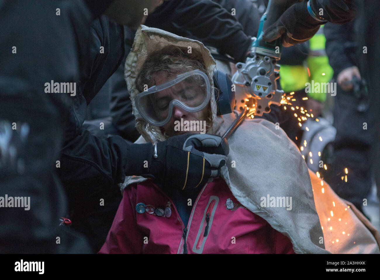 Westminster, London, UK. 8th Oct, 2019. Extinction rebellion protesters locked together on Whitehall, Westminster. Police use cutting gear to set them free. Penelope Barritt/Alamy Live News Stock Photo