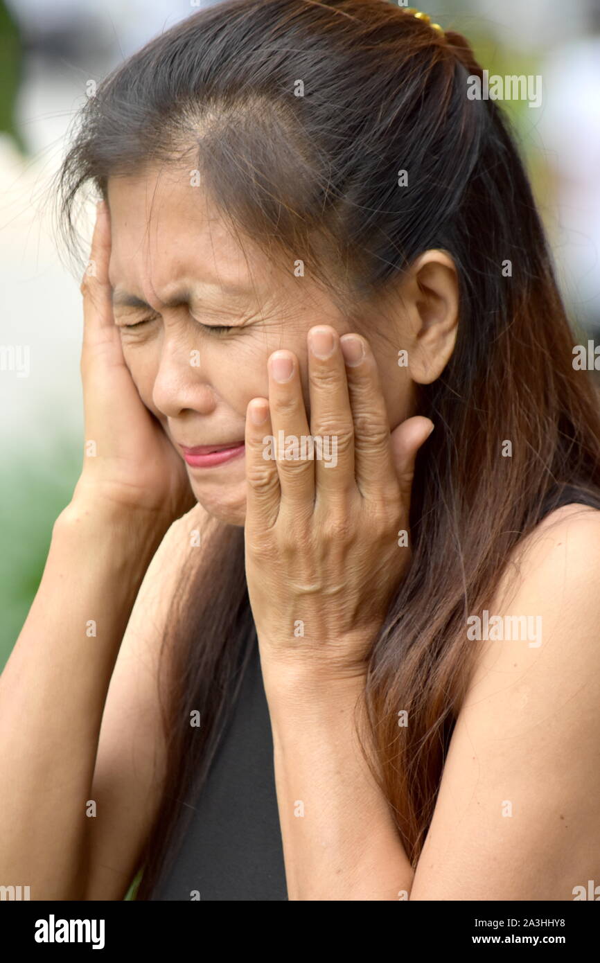 Retired Diverse Female Senior And Sadness Stock Photo