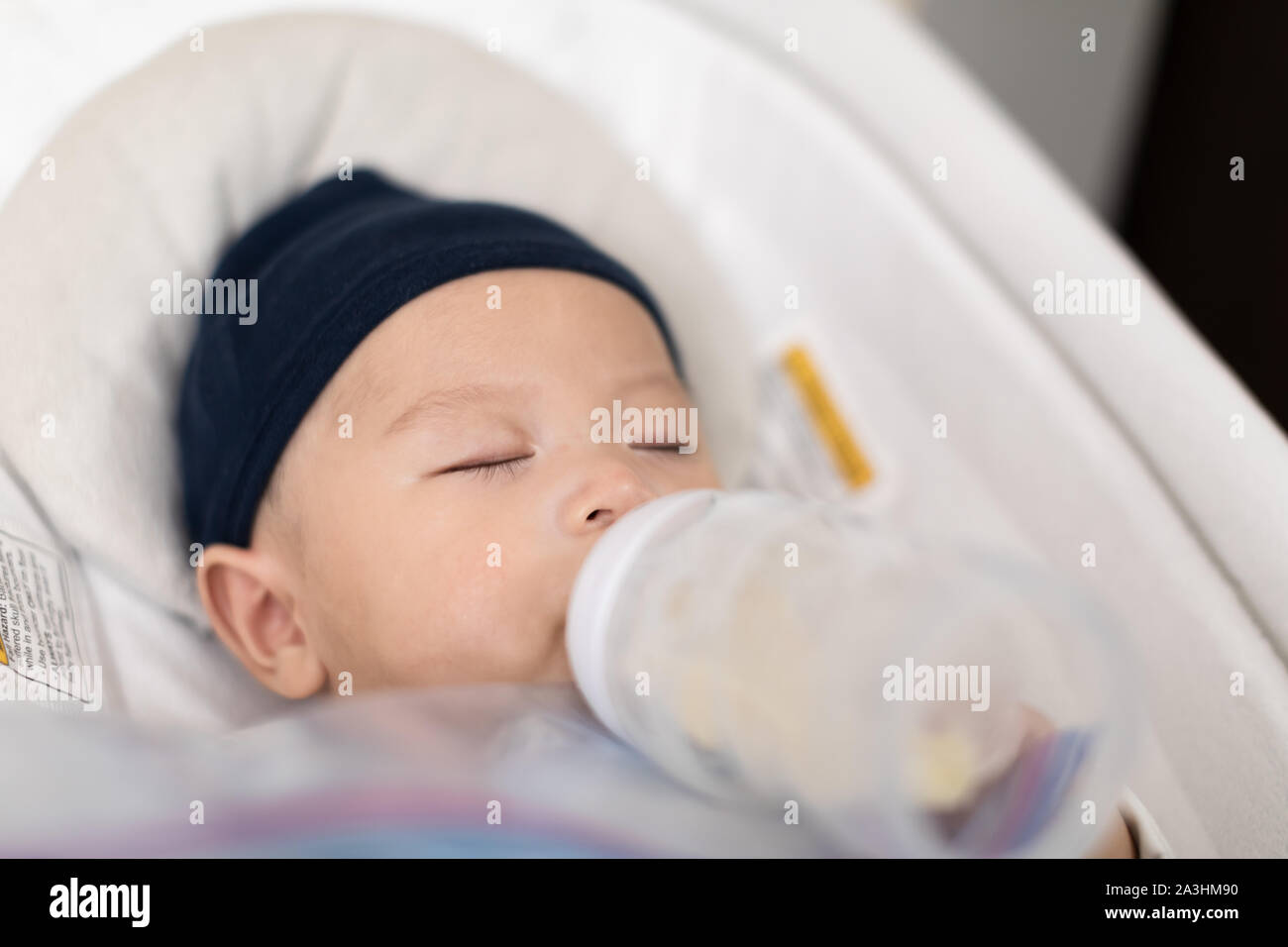 feeding baby in bouncer
