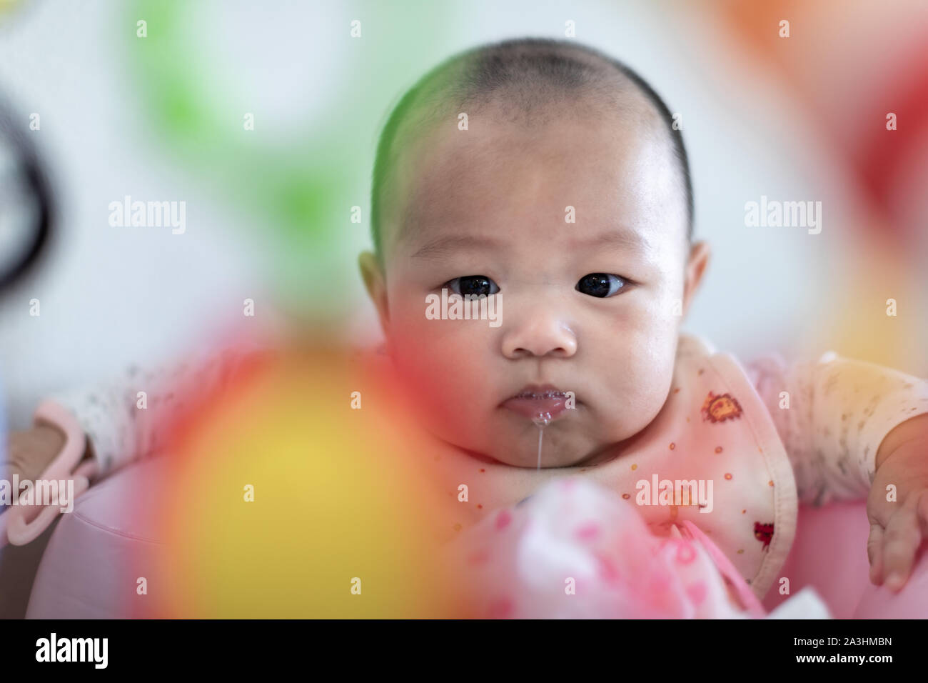 Little 4 months baby boy playing with toys at sweet home Stock Photo
