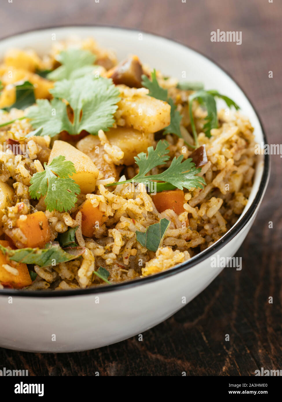 Gongura Biryani with rice, roselle leaves, carrots, potatoes, eggplant and onions Stock Photo