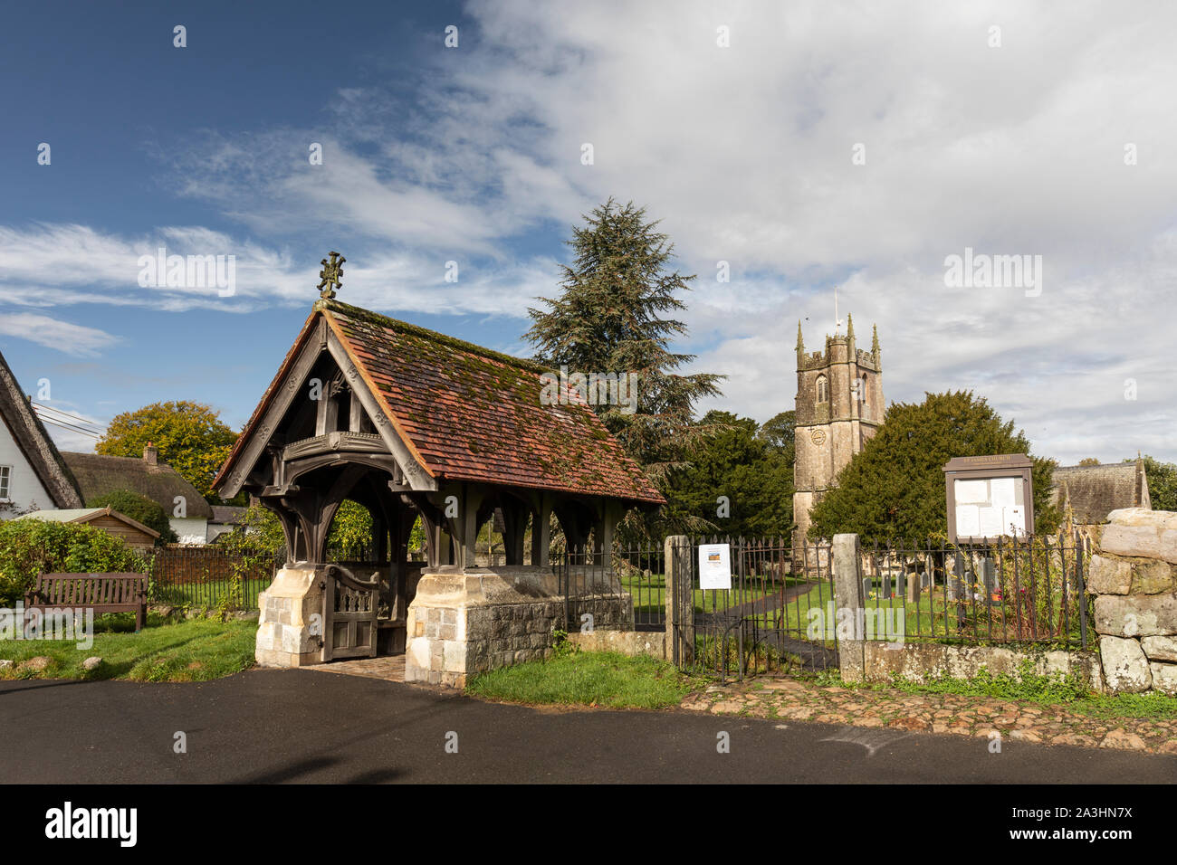 St James' Church and the lychgate which was erected in memory of Hannah Price and is a Grade II Listed Building, Avebury, Wiltshire, England, UK Stock Photo