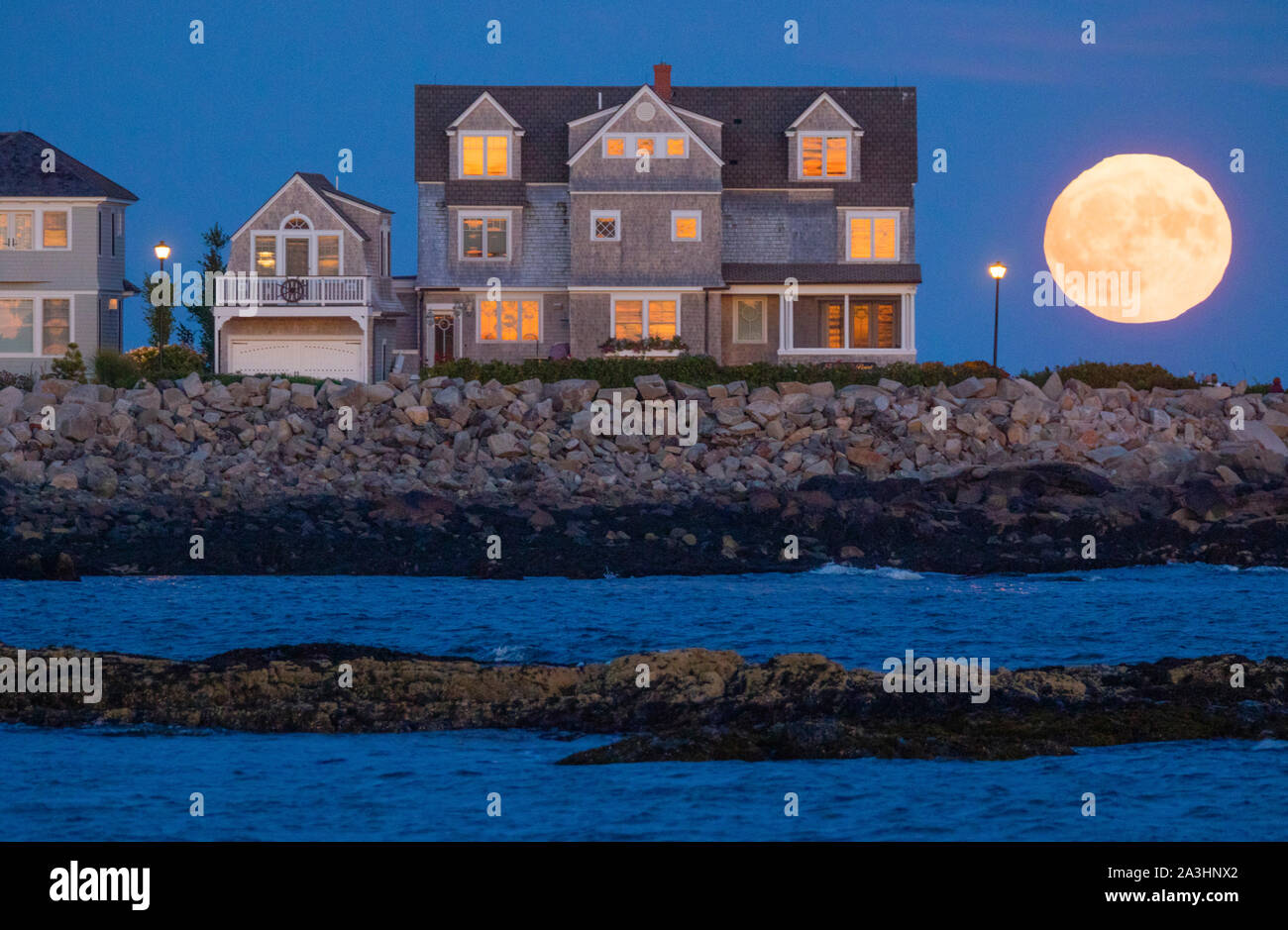 Harvest Moon rises near Maine coastal property Stock Photo Alamy