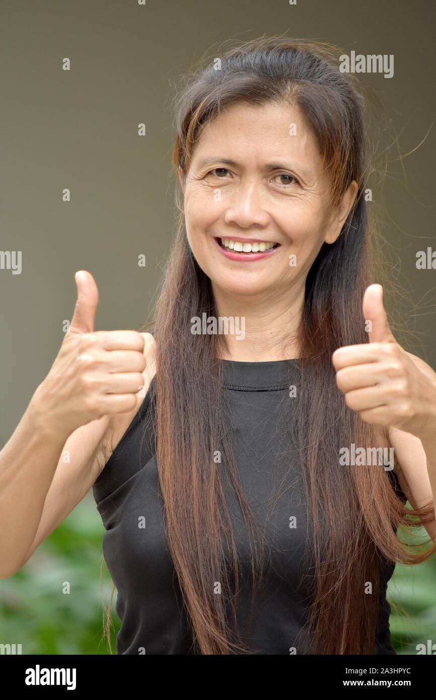 Minority Adult Female With Thumbs Up Stock Photo