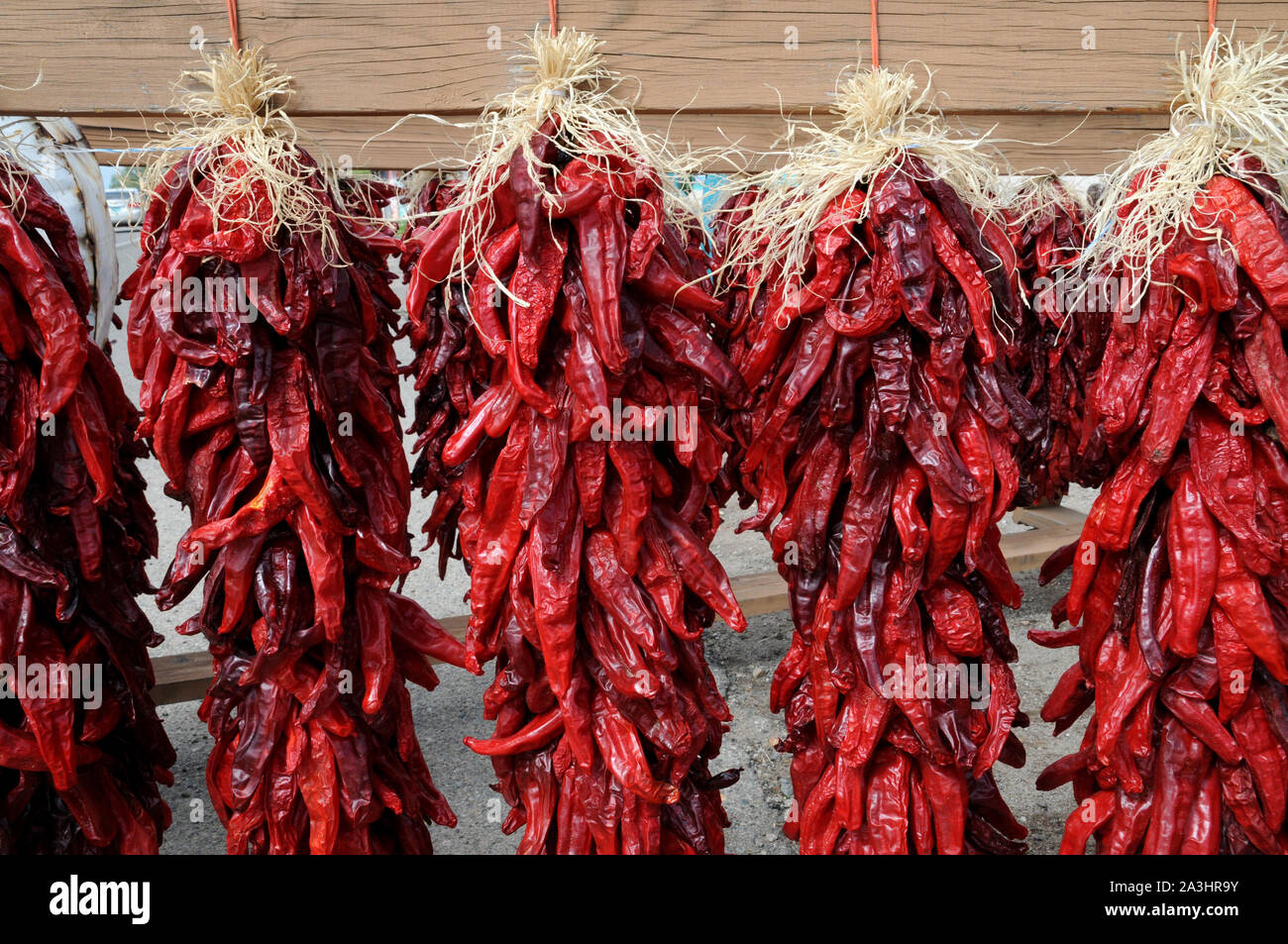 Chile (chille) peppers drying ouside a store in the town of Taos New Mexico USA. Stock Photo