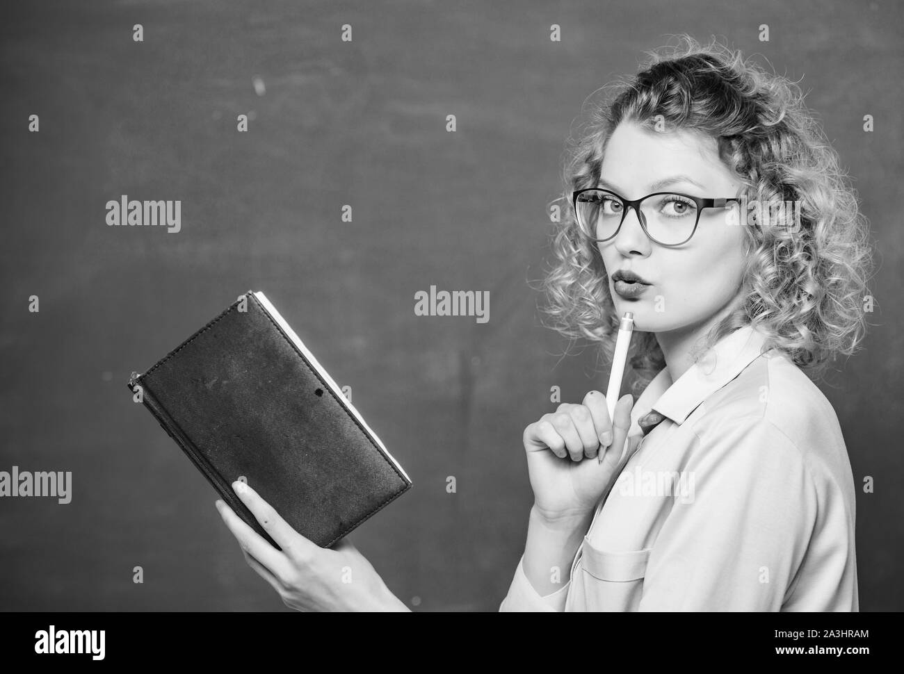 next school year. Girl prepare for exams. happy student in glasses at blackboard. girl teacher at private lesson. essay writing. teacher with book. report project. back to school. book writing. Stock Photo