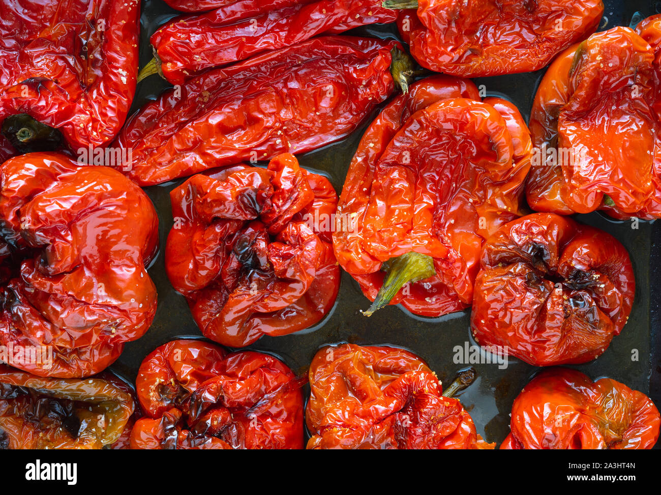 Roasted red peppers in baking tray. Top view. Stock Photo
