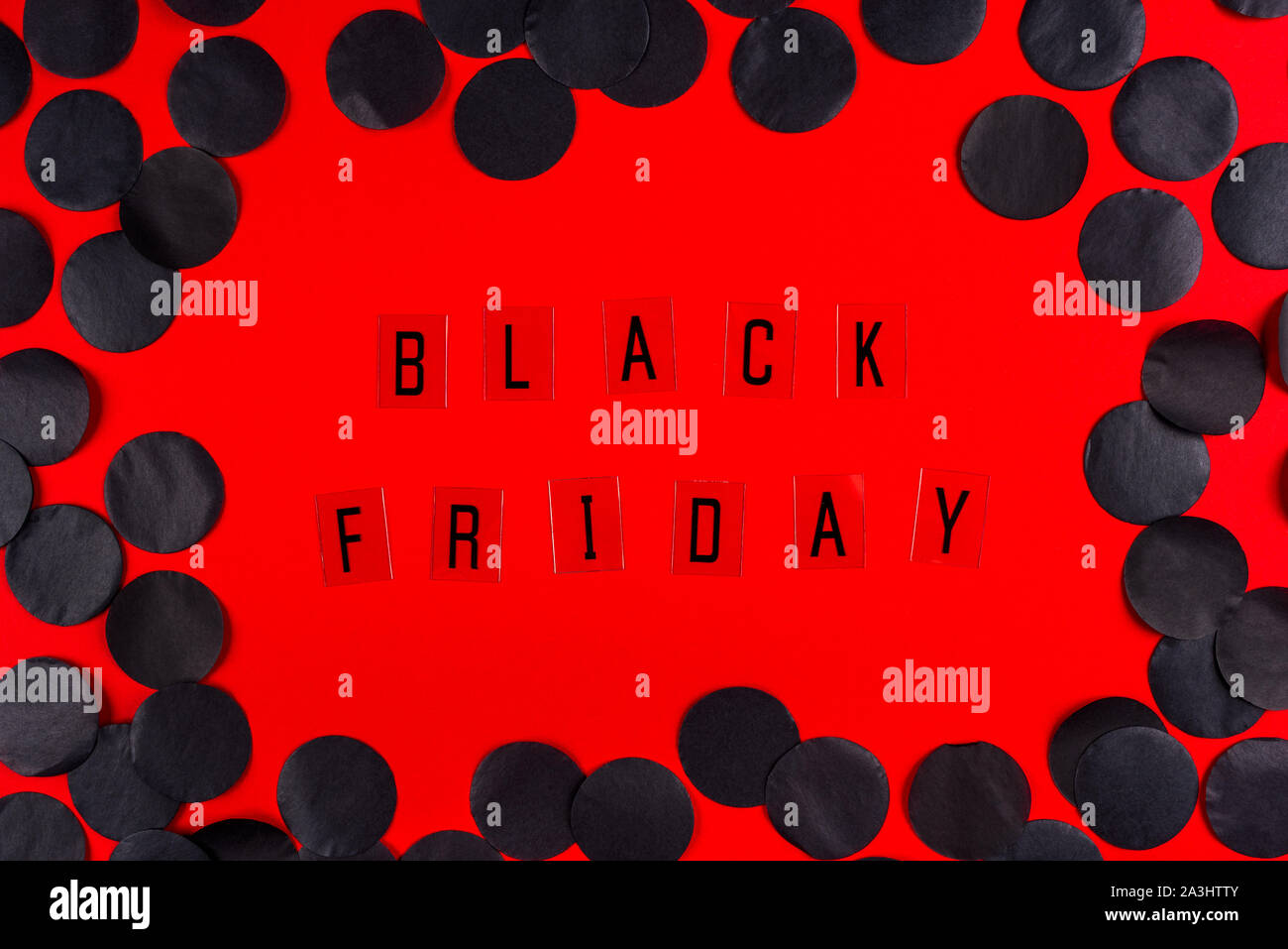 Black Friday sale tag on red background. Stock Photo