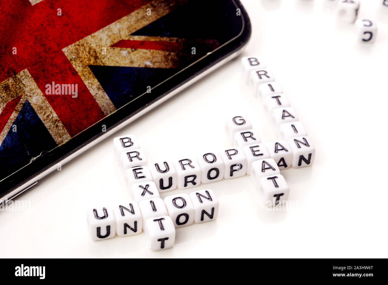 little white dices with black letters forming a crossword with the