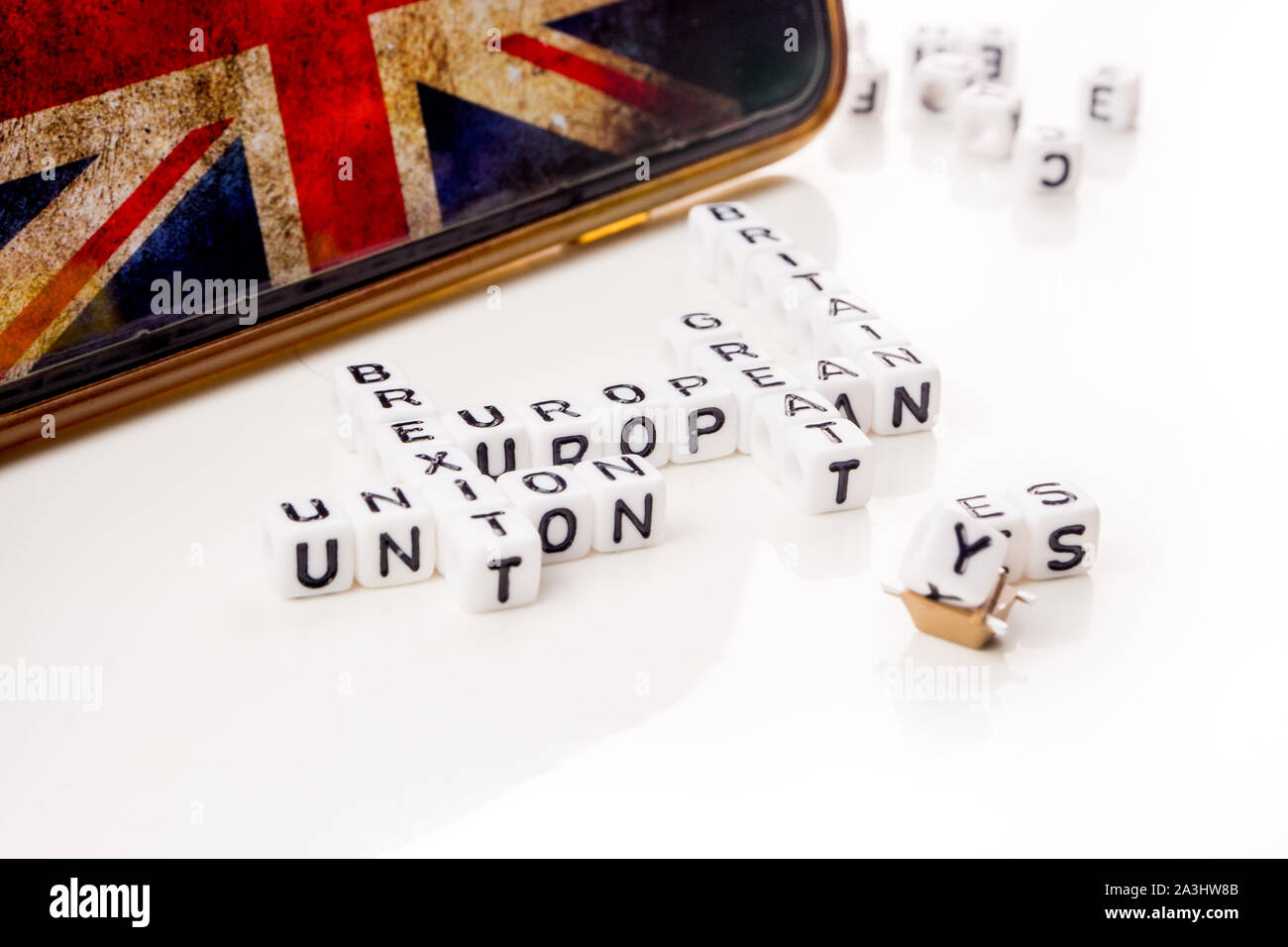 little white dices with black letters forming a crossword with the