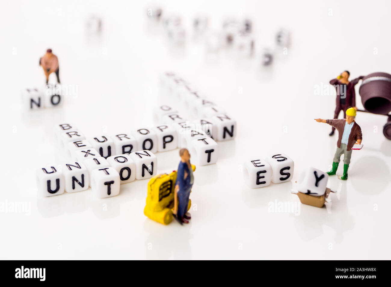 little white dices with black letters forming a crossword with the