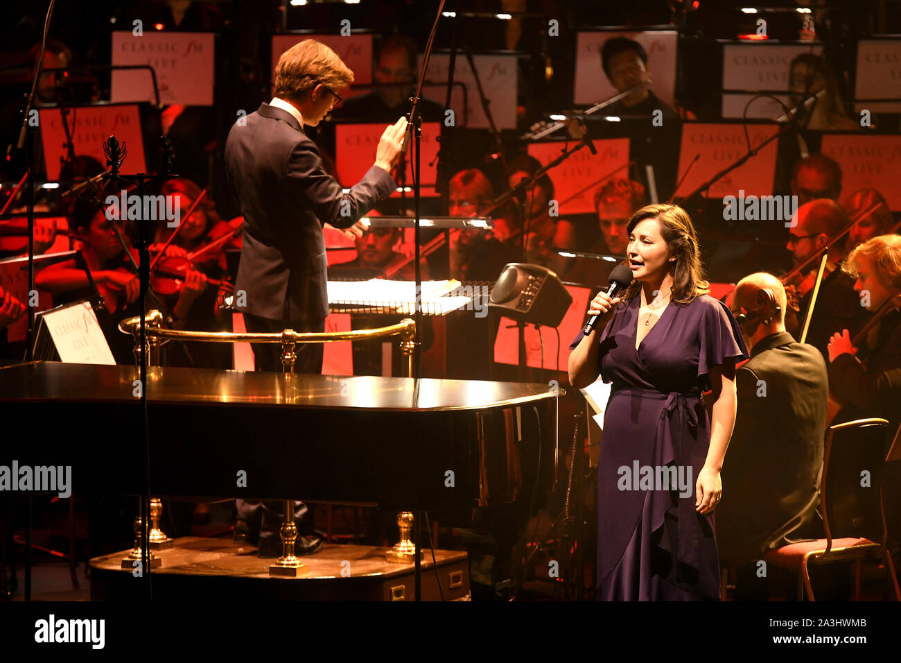 Sara Brimer Davey performs as Gareth Malone conducts the Bournemouth Symphony Orchestra at Classic FM Live at London's Royal Albert Hall. Stock Photo