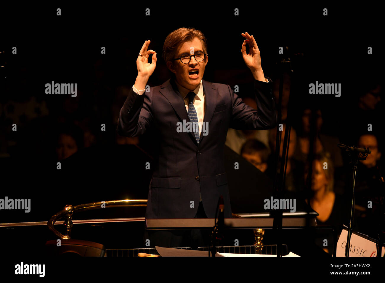 Gareth Malone conducts the Bournemouth Symphony Orchestra and Chorus at Classic FM Live at London's Royal Albert Hall. Stock Photo