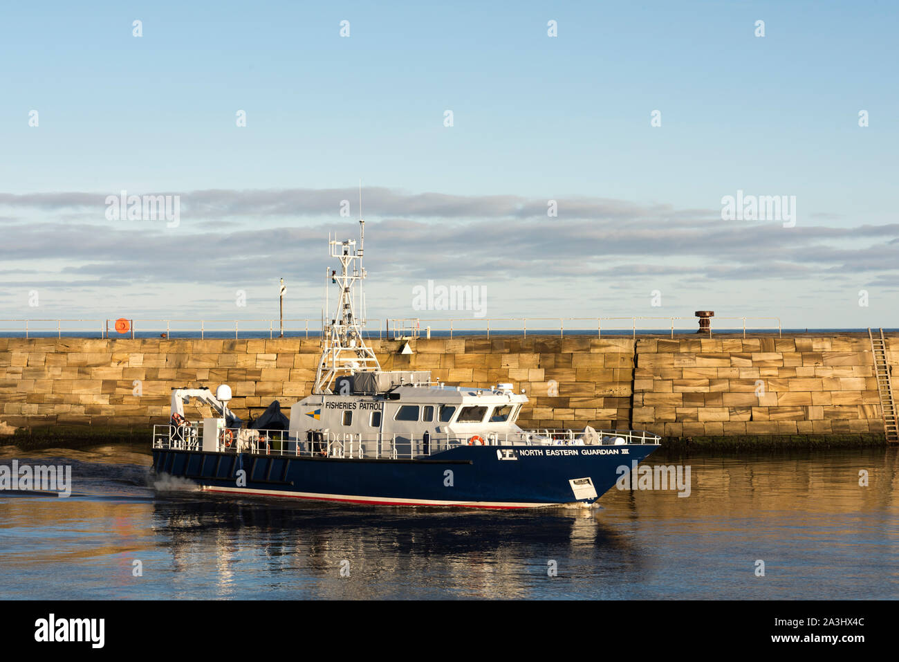 Fisheries patrol boat entering Whitby Harbour, North Yorkshire. Stock Photo