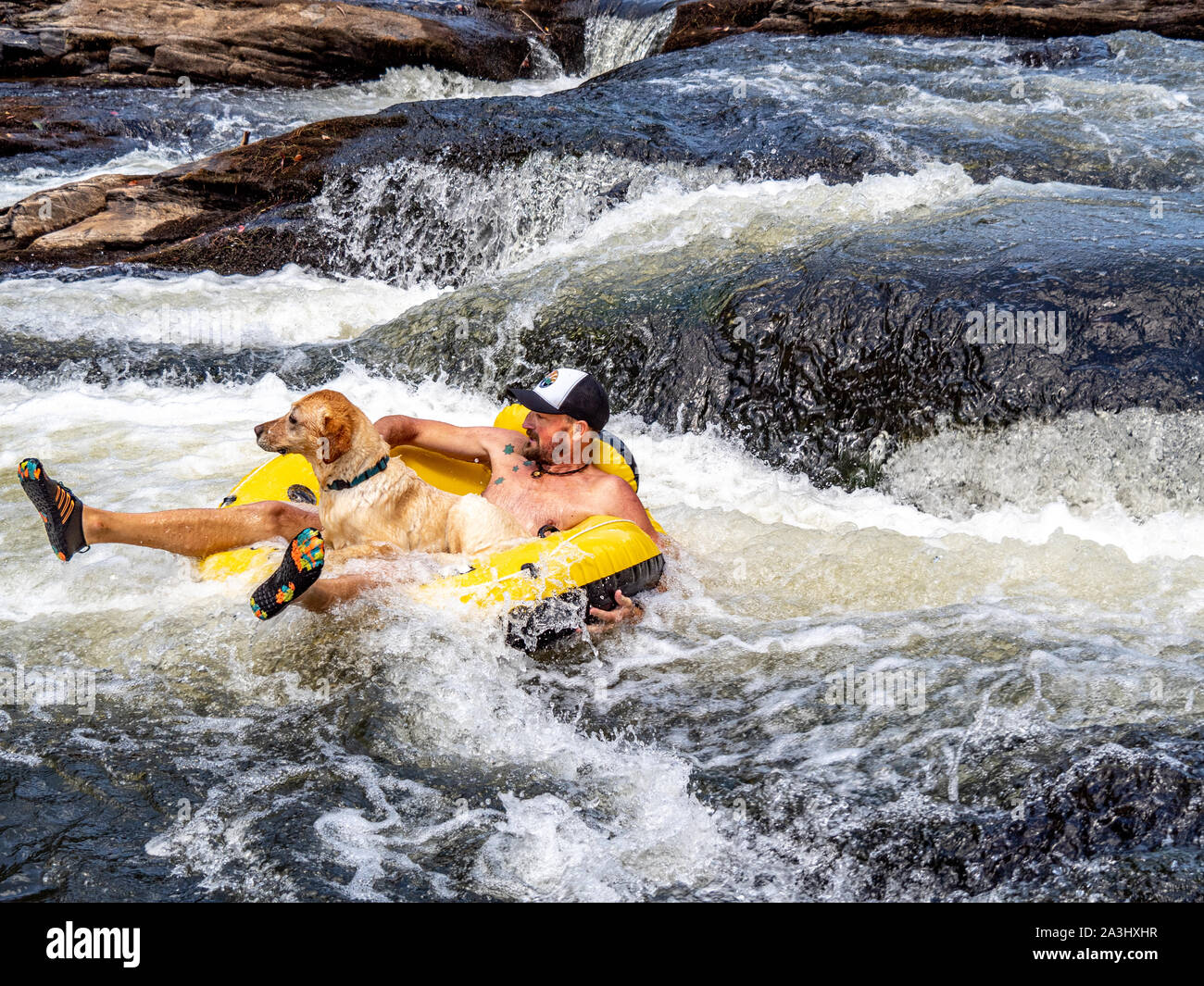 Man floating in an inner tube hi-res stock photography and images - Alamy