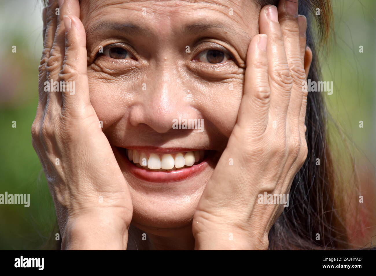 A Minority Female Senior And Happiness Stock Photo