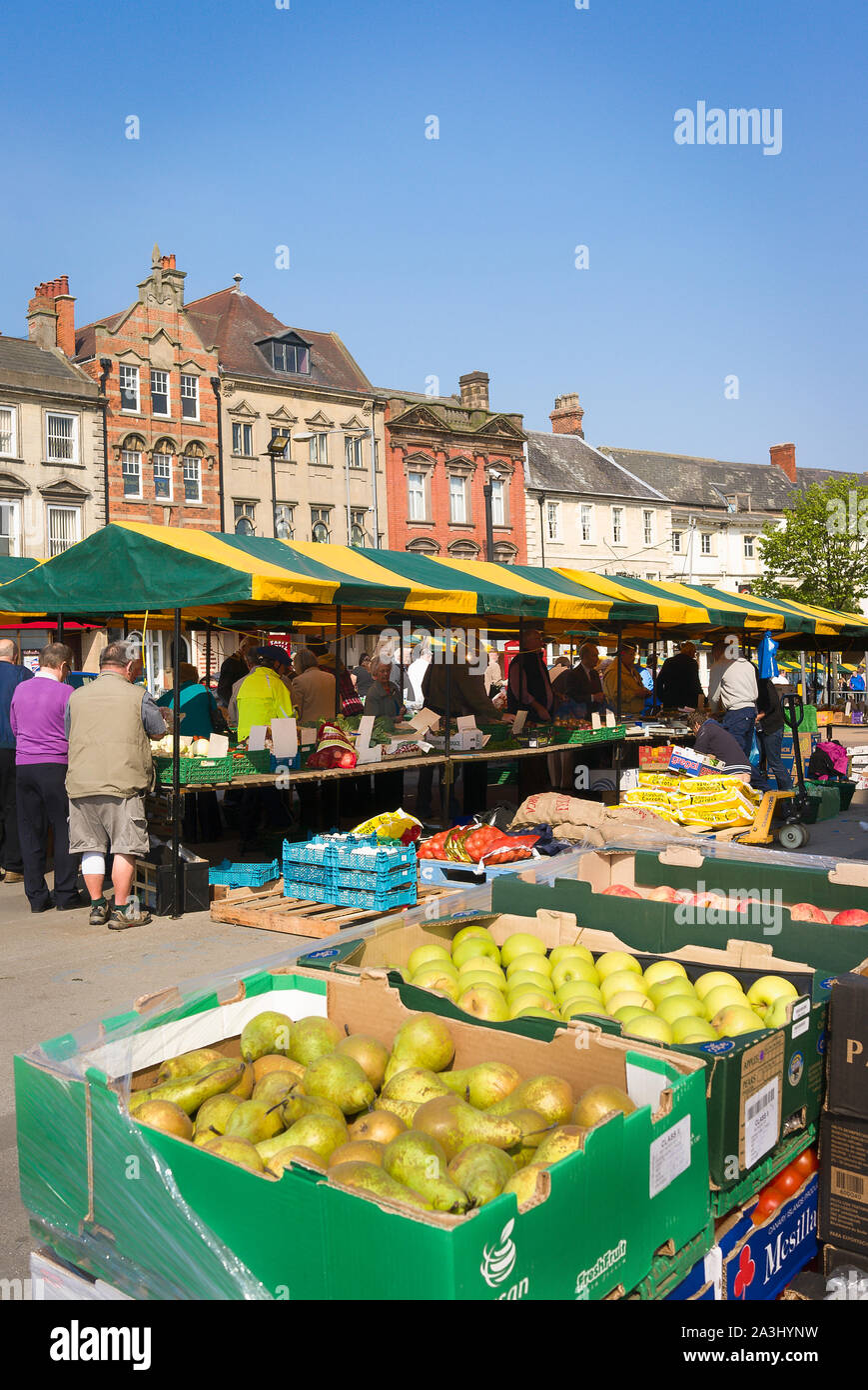 Fresh fruit and other commodities displayed for sale in Worksop market place in England UK Stock Photo