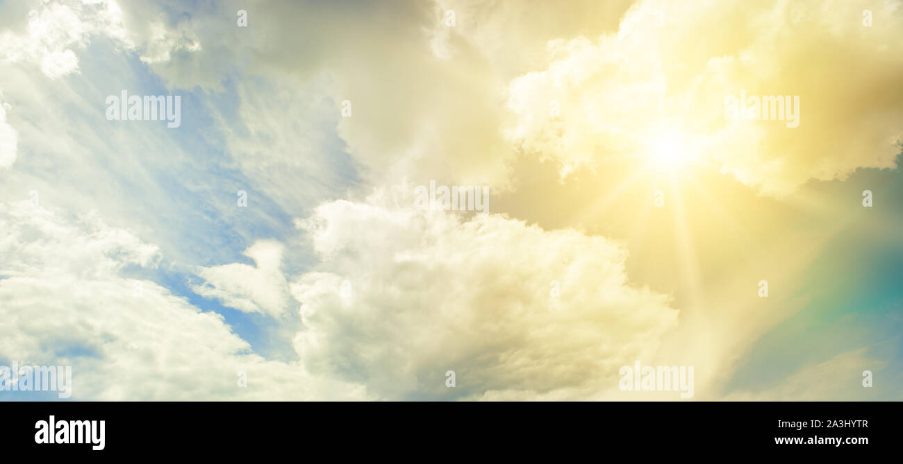 Sun on blue sky with beautiful white clouds Stock Photo - Alamy