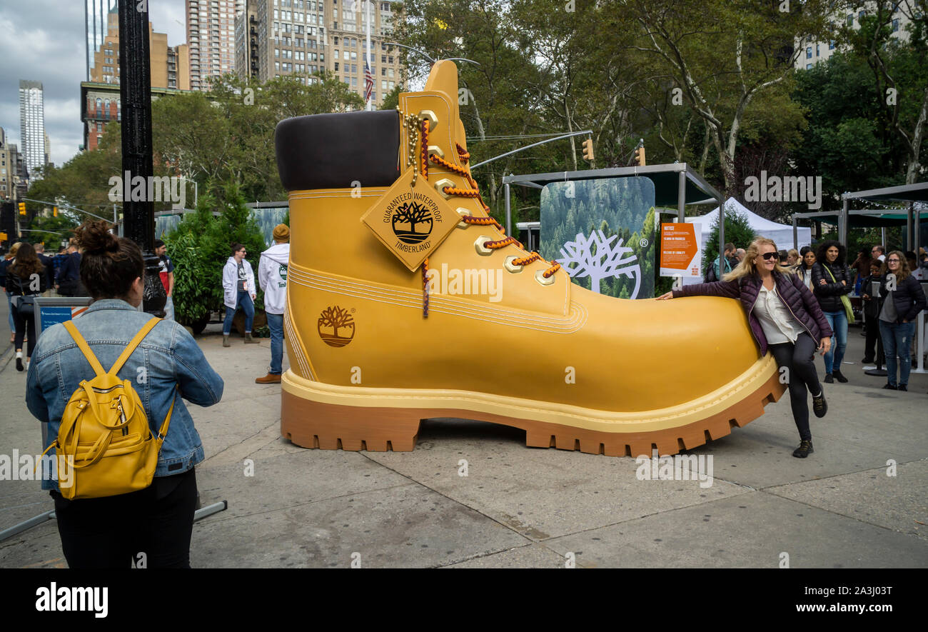 Visitors to Flatiron Plaza in New York on Friday, October 4, 2019  participate in a branding event for VF Corp.'s Timberland boots and apparel  brand. By taking a pledge to support the