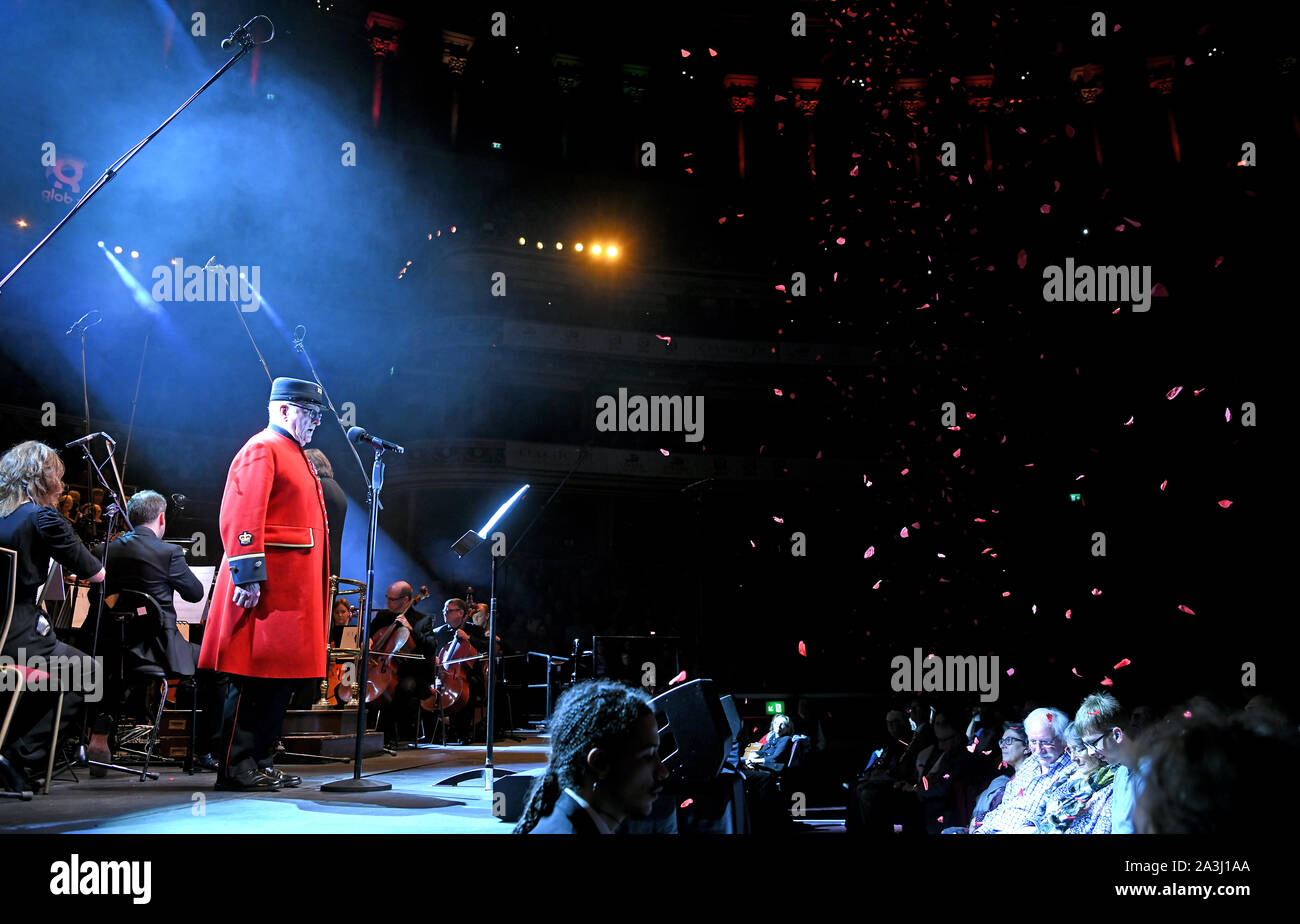 Colin Thackery performs with the Bournemouth Sympathy Orchastra as petals fall from the ceiling at Classic FM Live at London's Royal Albert Hall. Stock Photo