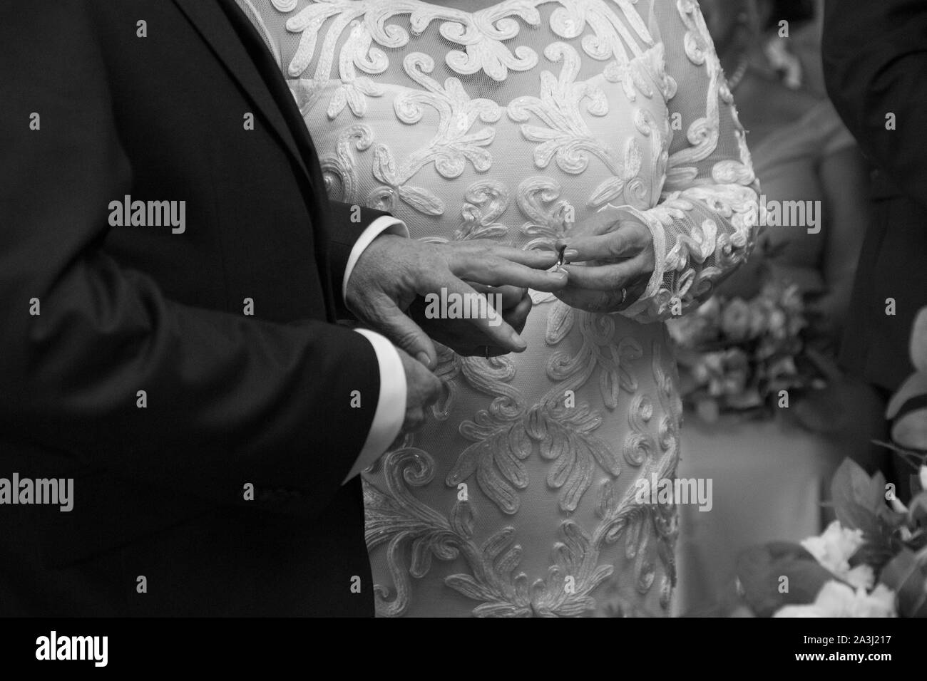 Bride and grooms hands on their wedding day, close up of Bride and Grooms hands at their wedding on their Wedding Day in Worcestershire England, UK Stock Photo