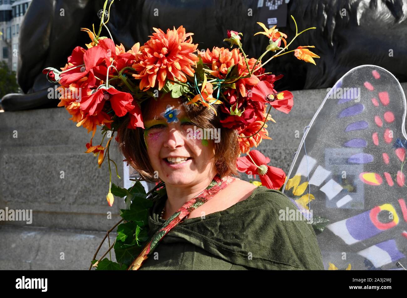 Protester with floral headgear. Extinction Rebellion Protest Day Two. London. UK Stock Photo